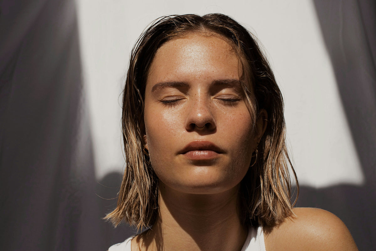 Woman with closed eyes in soft daylight