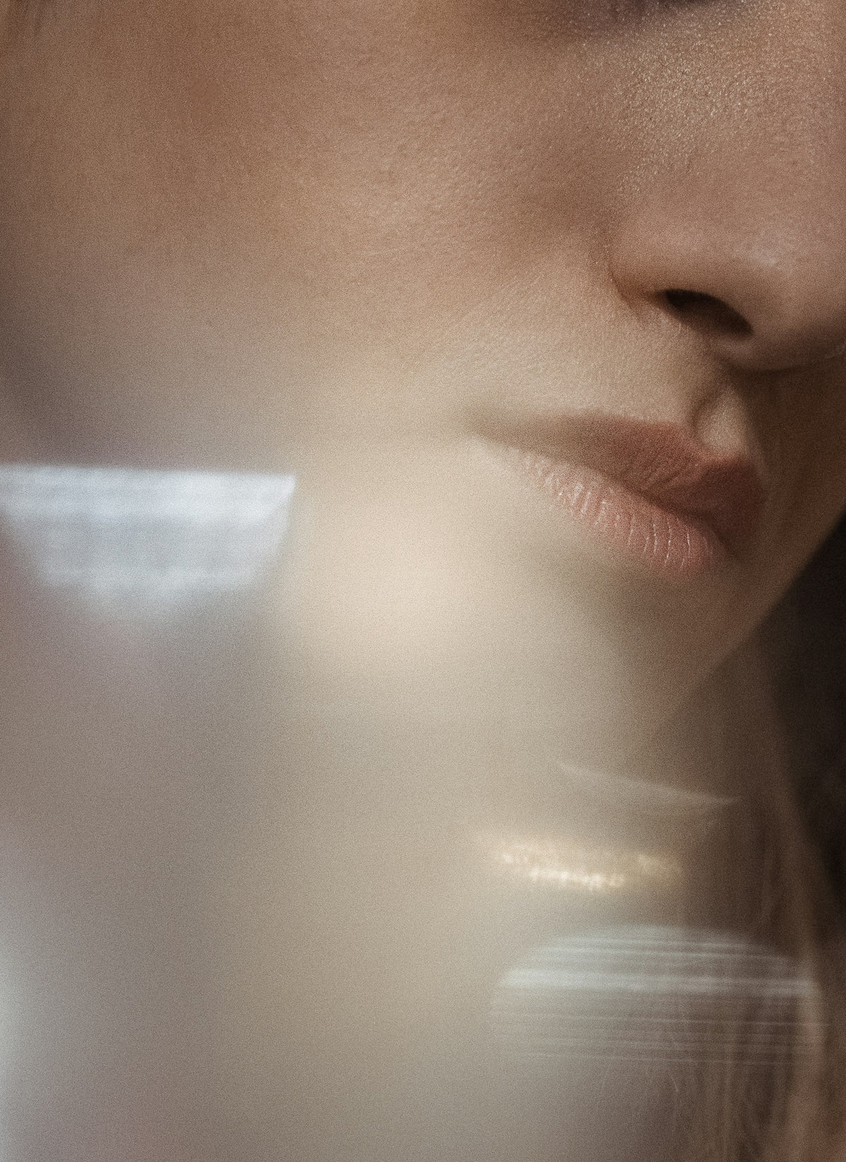 Close-up of soft skin and lips in gentle light