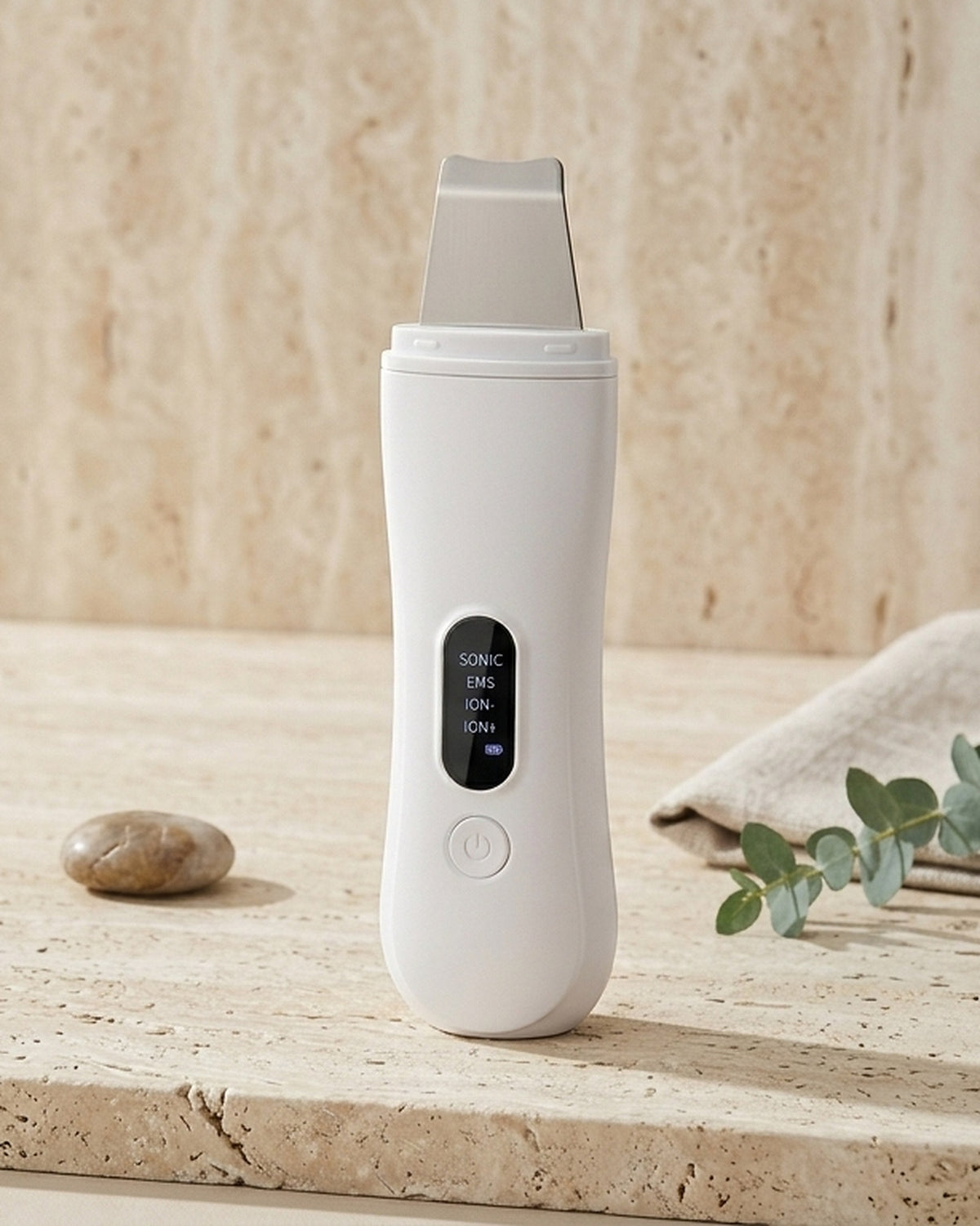 Sonave ultrasonic skin scrubber on a travertine bathroom shelf